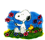 Snoopy smelling the flowers.